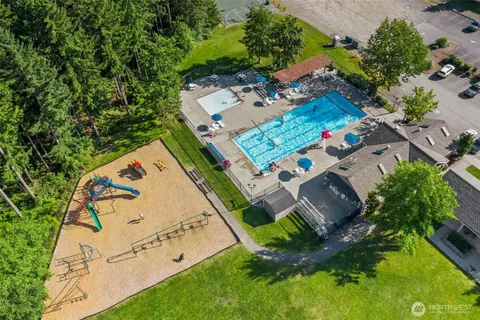 an aerial view of a house with a yard