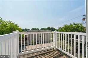 a balcony with wooden floor