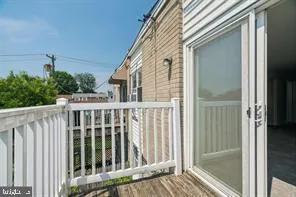 a view of a balcony with wooden floor