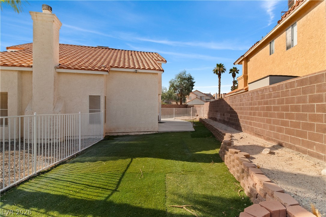 3156 Terrace View Drive Laughlin, NV 89029 - Photo 64 of 94 A private backyard oasis with low-maintenance artificial turf and sturdy block walls awaits.