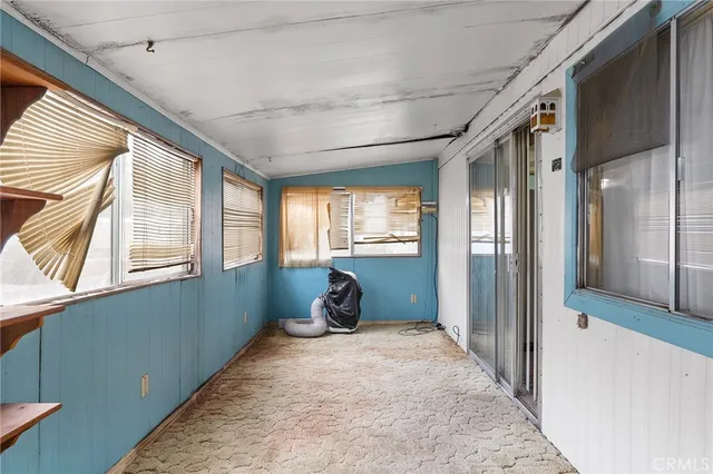 a view of entryway with wooden walls