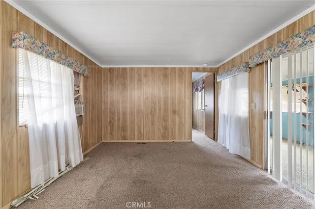 a kitchen with cabinets appliances and a window