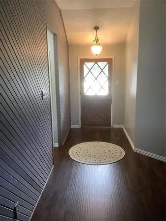 an outdoor space with view of a bathroom