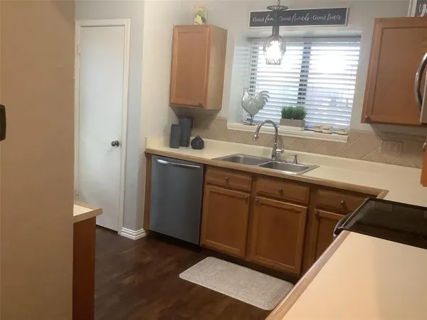 a kitchen with a sink and a window