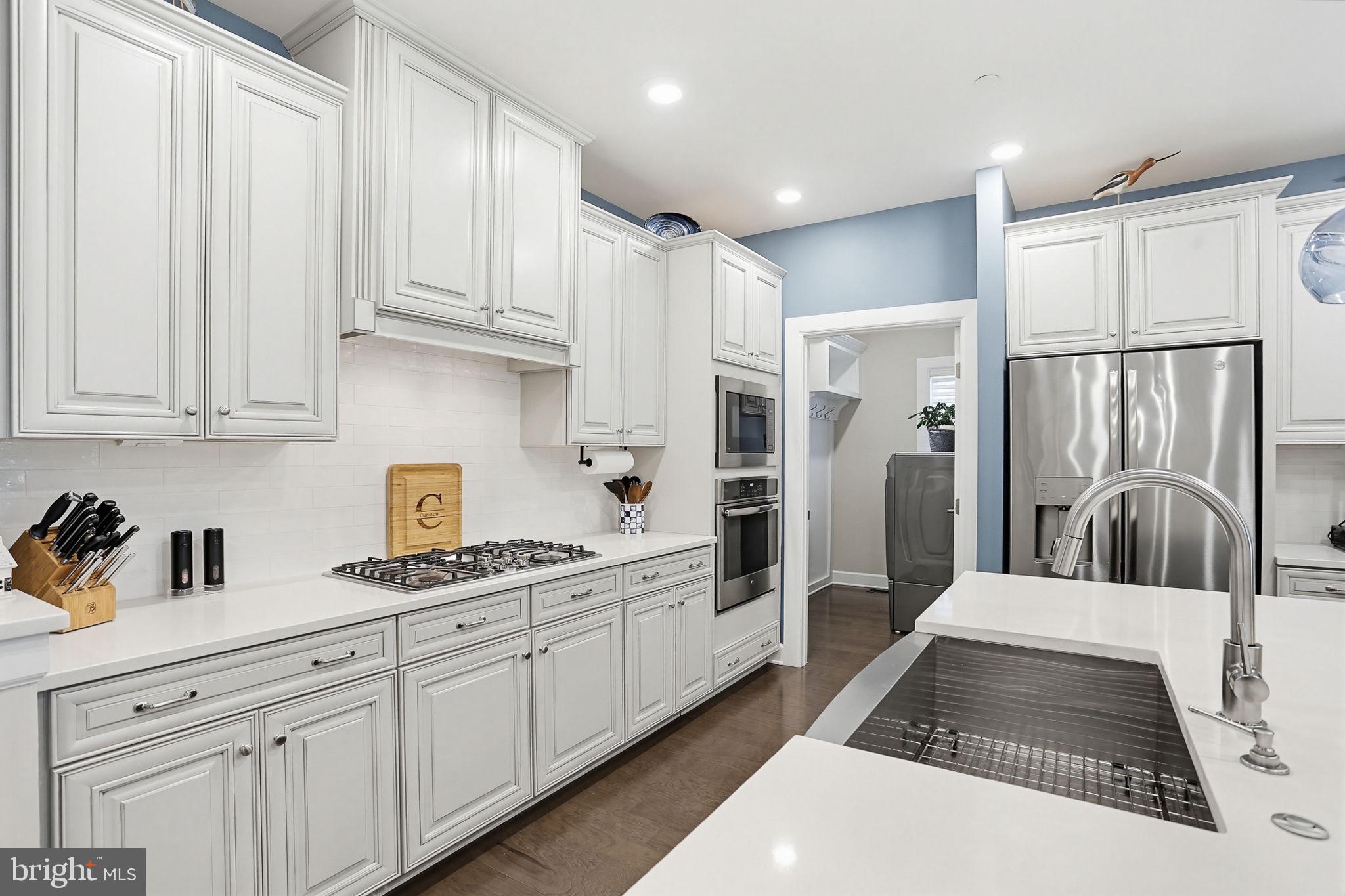 3816 Fulham Road Frederick, MD 21704 - Photo 16 of 77 a kitchen with stainless steel appliances granite countertop a refrigerator sink and cabinets