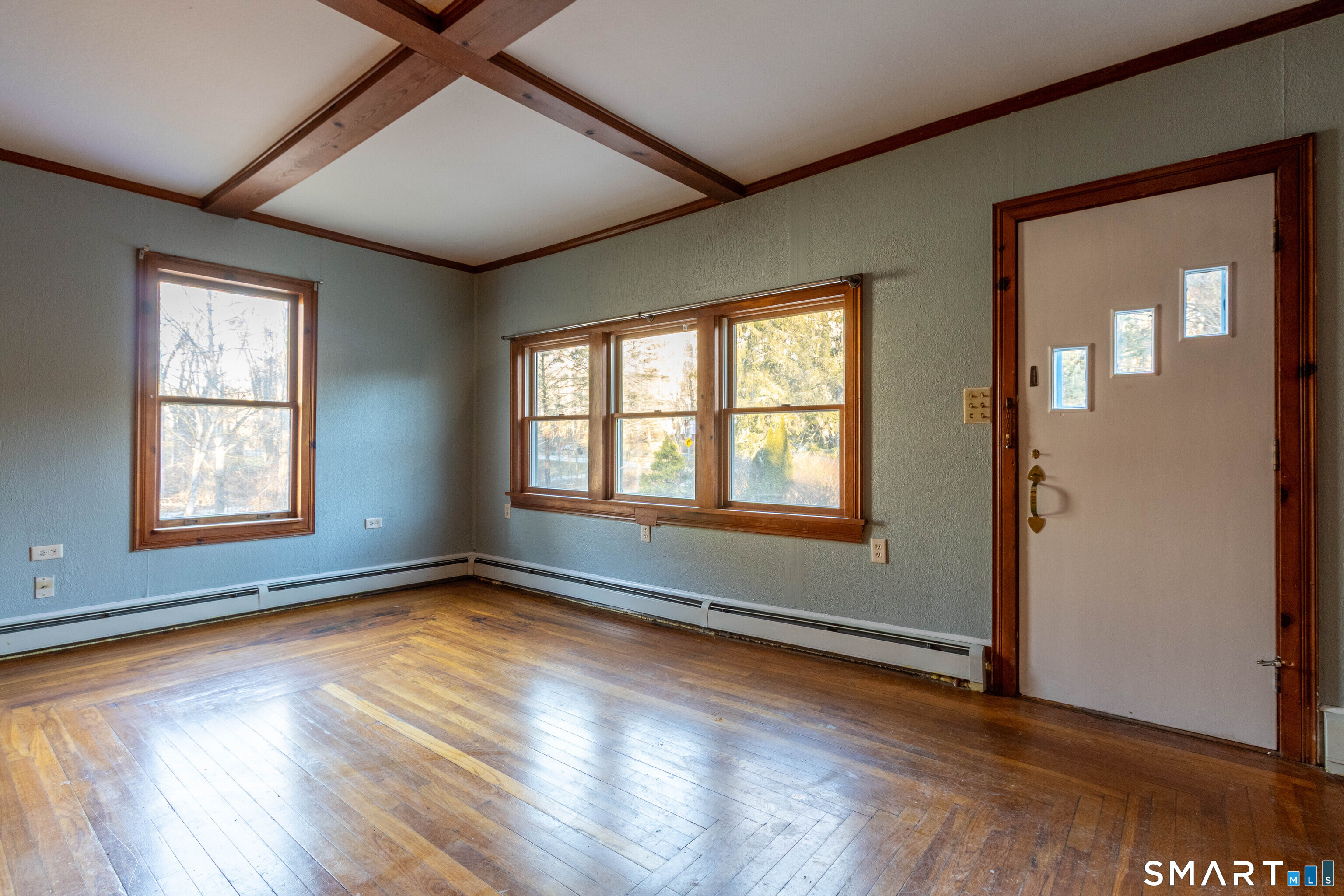 1661 Center Groton Road Ledyard, CT 06339 - Photo 8 of 39 an empty room with wooden floor and windows