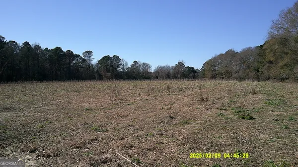 a view of a red sign in front of a house