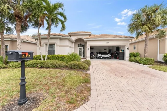 a view of a street with potted plants