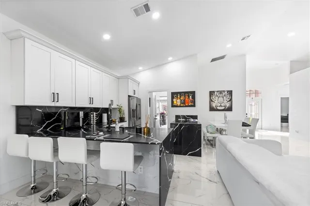 a kitchen with a table and chairs