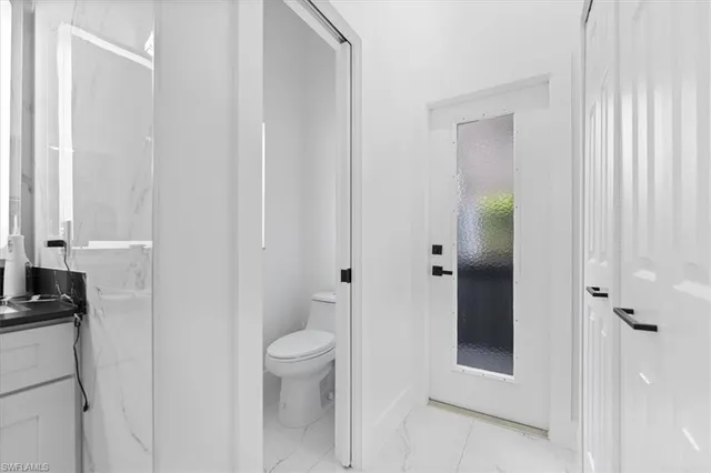 a bathroom with a toilet and a sink