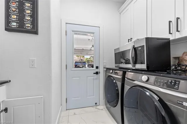 a view of kitchen and washer and dryer