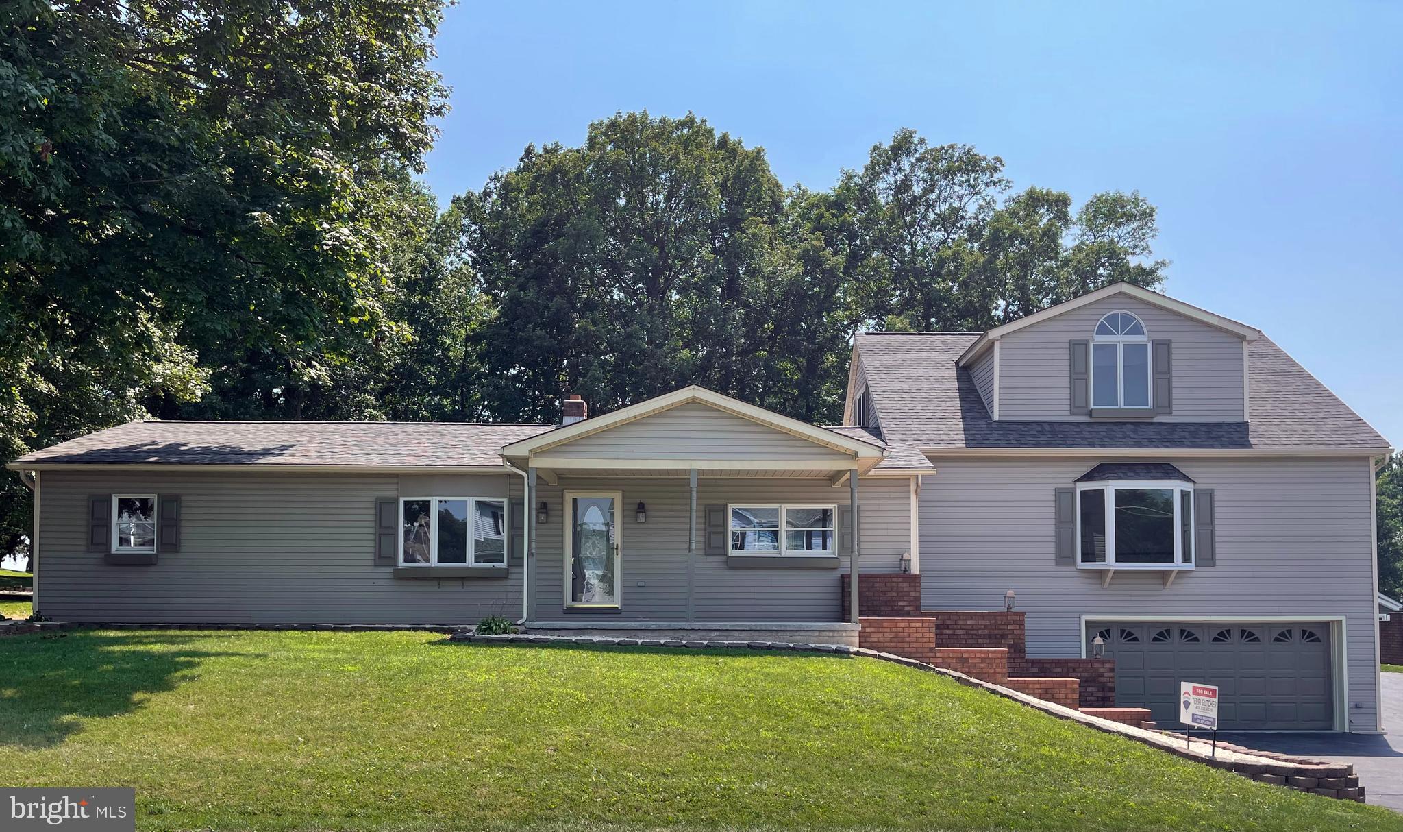 345 Pine Grove Road Hanover, PA 17331 - Photo 1 of 37 a front view of a house with a yard