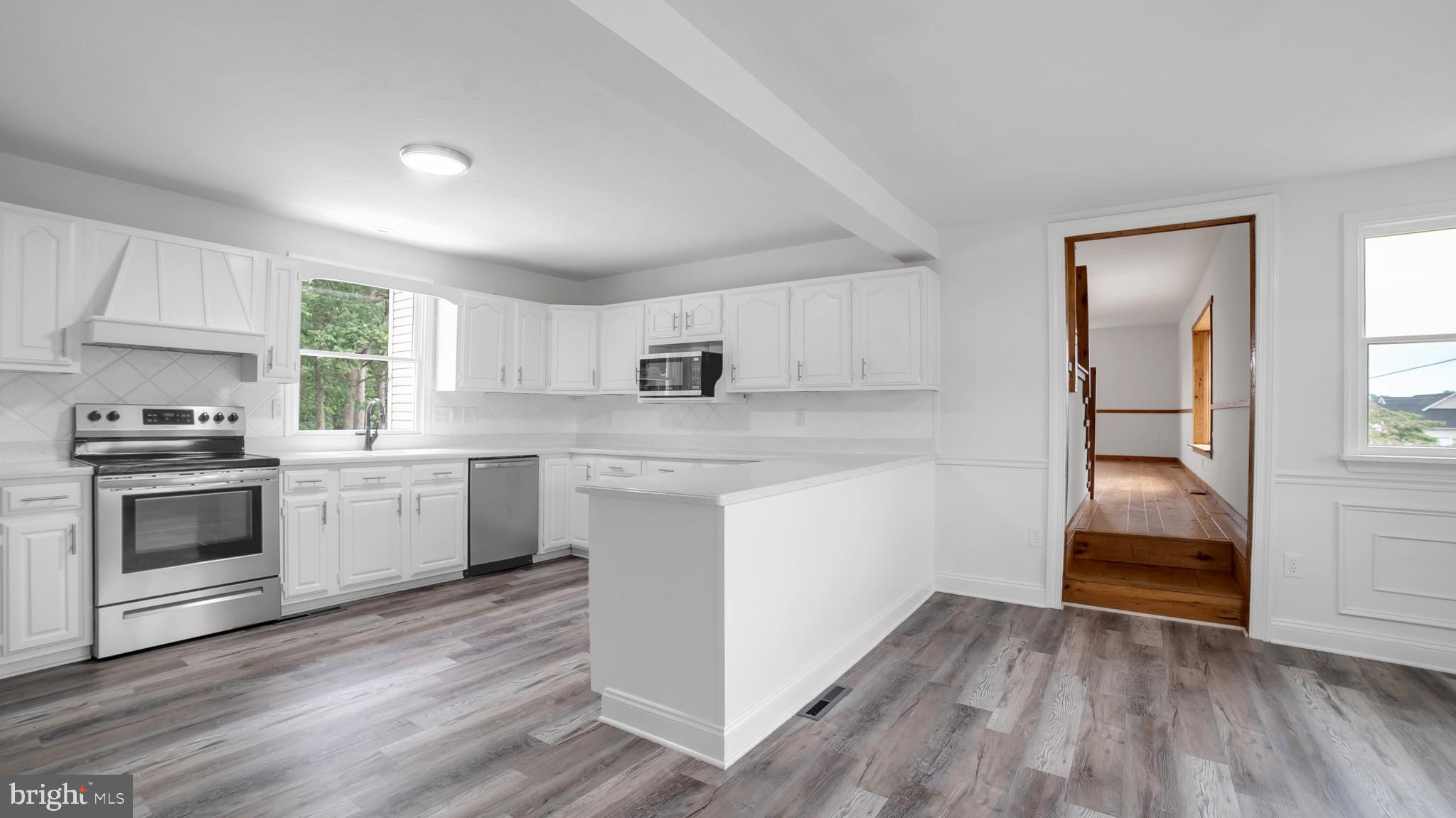 345 Pine Grove Road Hanover, PA 17331 - Photo 2 of 37 a kitchen with granite countertop white cabinets and white appliances