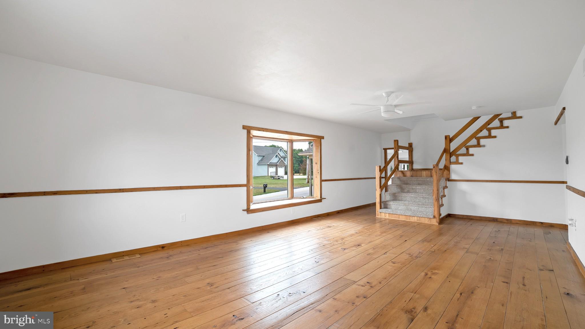 345 Pine Grove Road Hanover, PA 17331 - Photo 12 of 37 a view of an empty room with wooden floor and a window