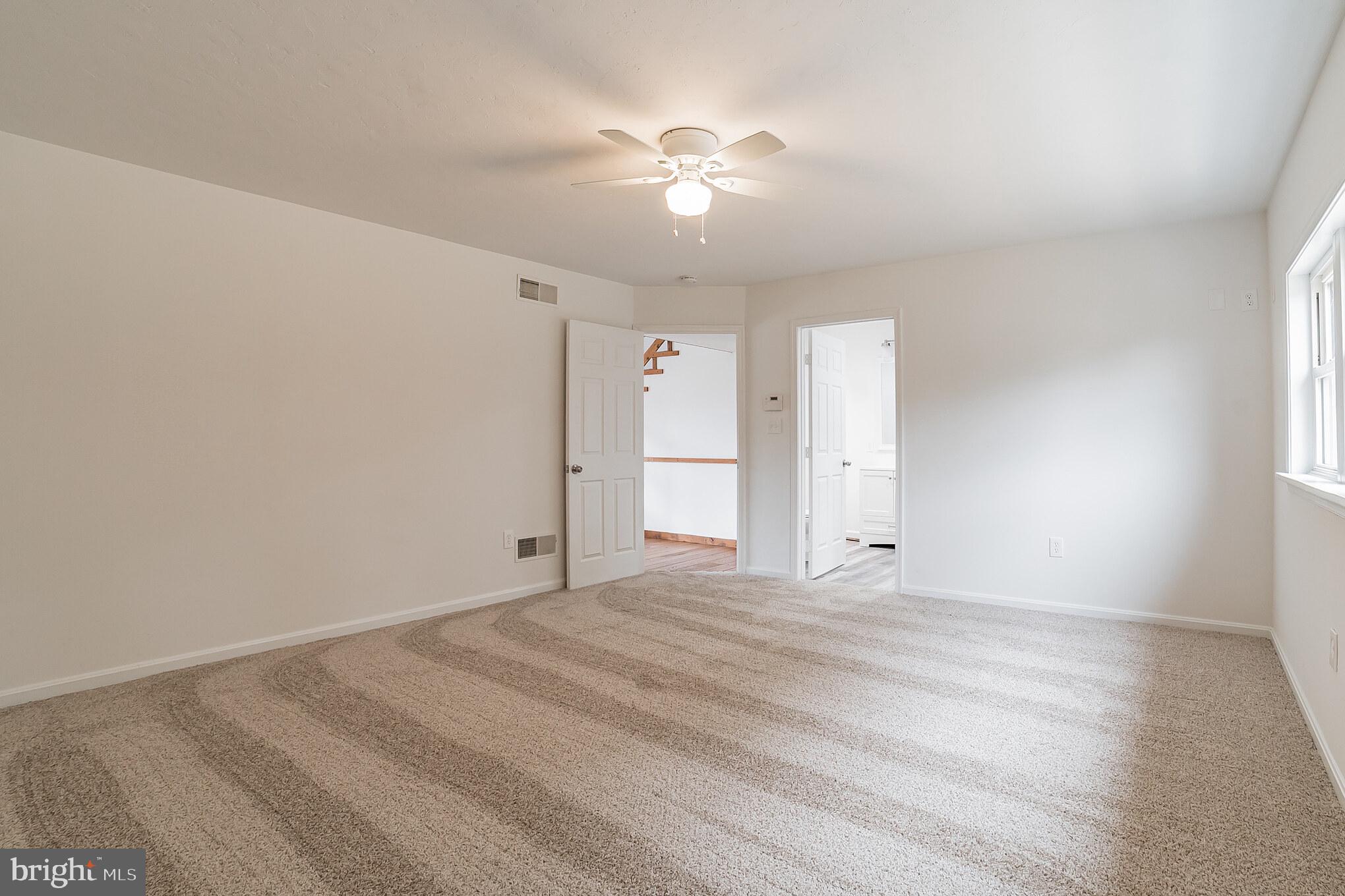 345 Pine Grove Road Hanover, PA 17331 - Photo 15 of 37 a view of an empty room with a ceiling fan