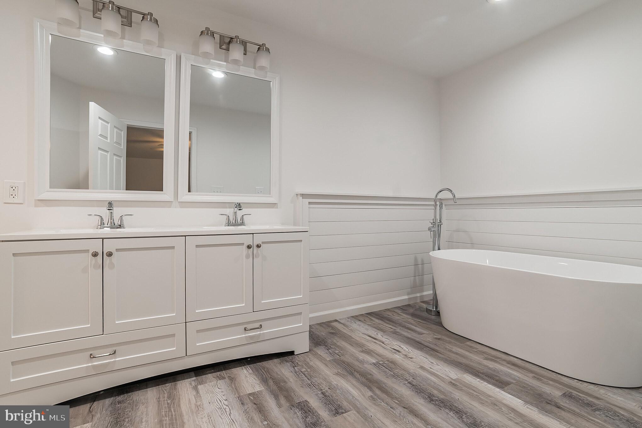 345 Pine Grove Road Hanover, PA 17331 - Photo 16 of 37 a bathroom with a bathtub a sink and a mirror