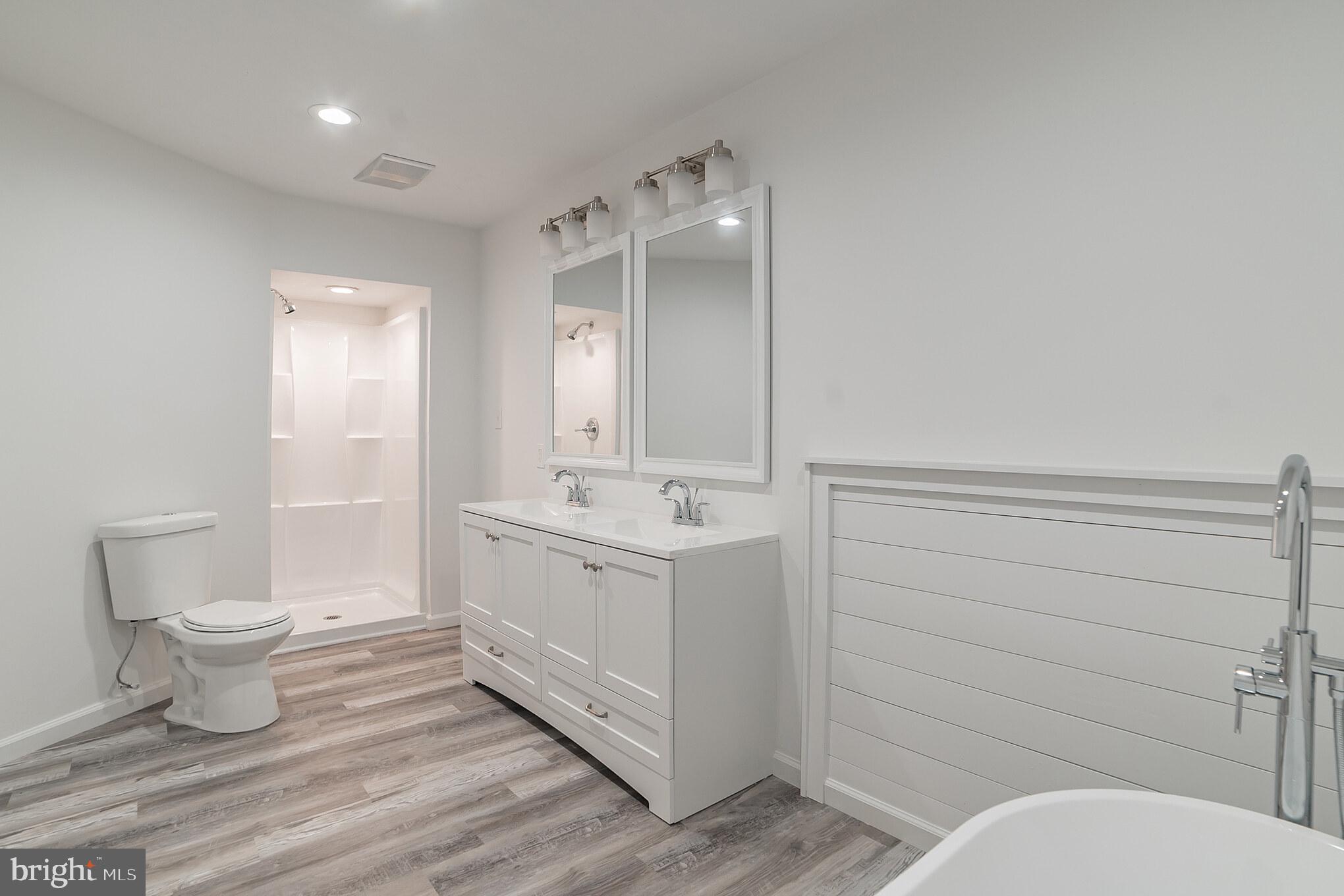 345 Pine Grove Road Hanover, PA 17331 - Photo 17 of 37 a bathroom with a sink mirror vanity and toilet