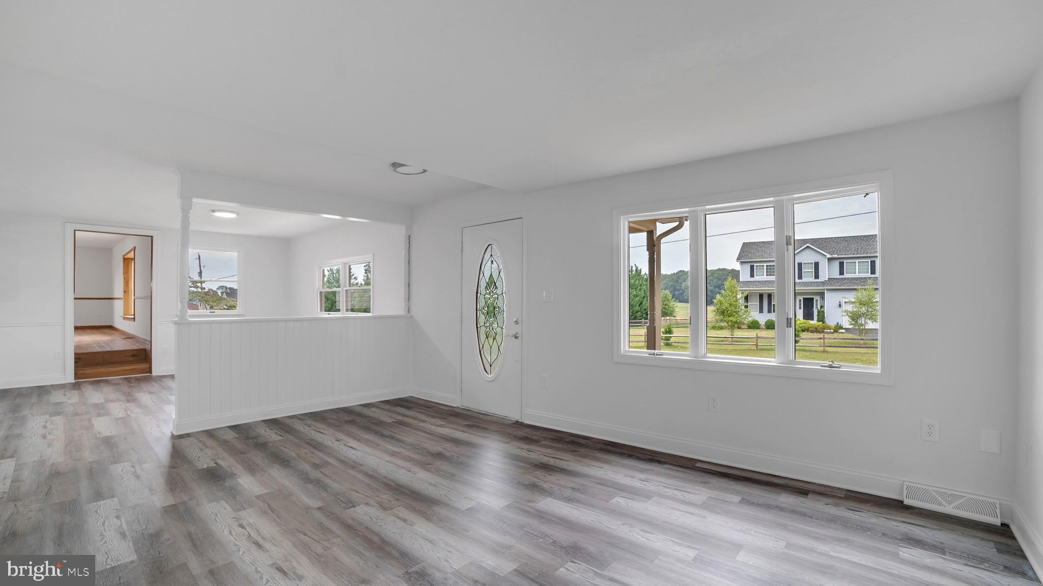345 Pine Grove Road Hanover, PA 17331 - Photo 6 of 37 a view of an empty room with wooden floor and a window