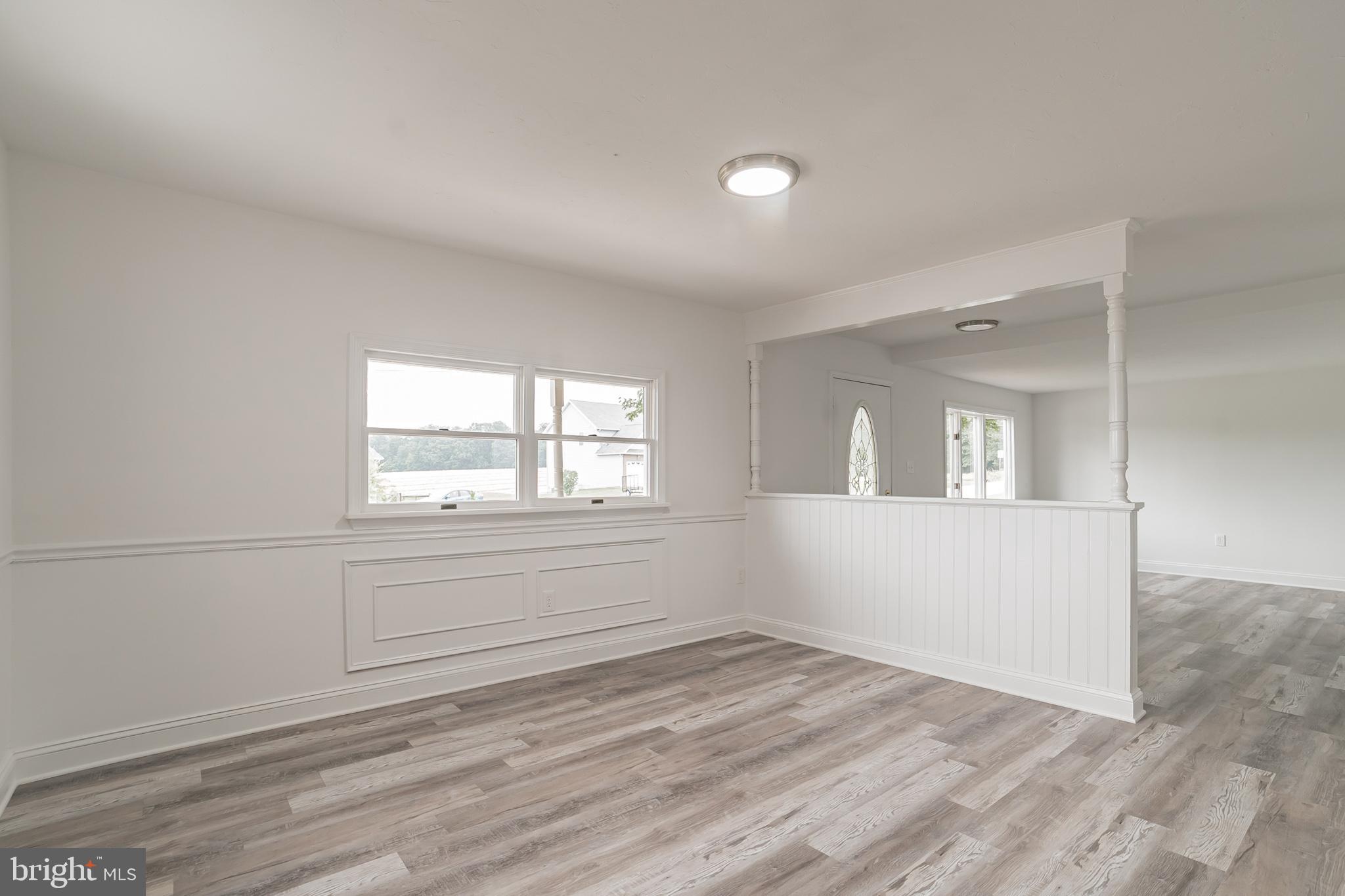 345 Pine Grove Road Hanover, PA 17331 - Photo 9 of 37 a view of an empty room with wooden floor and a window