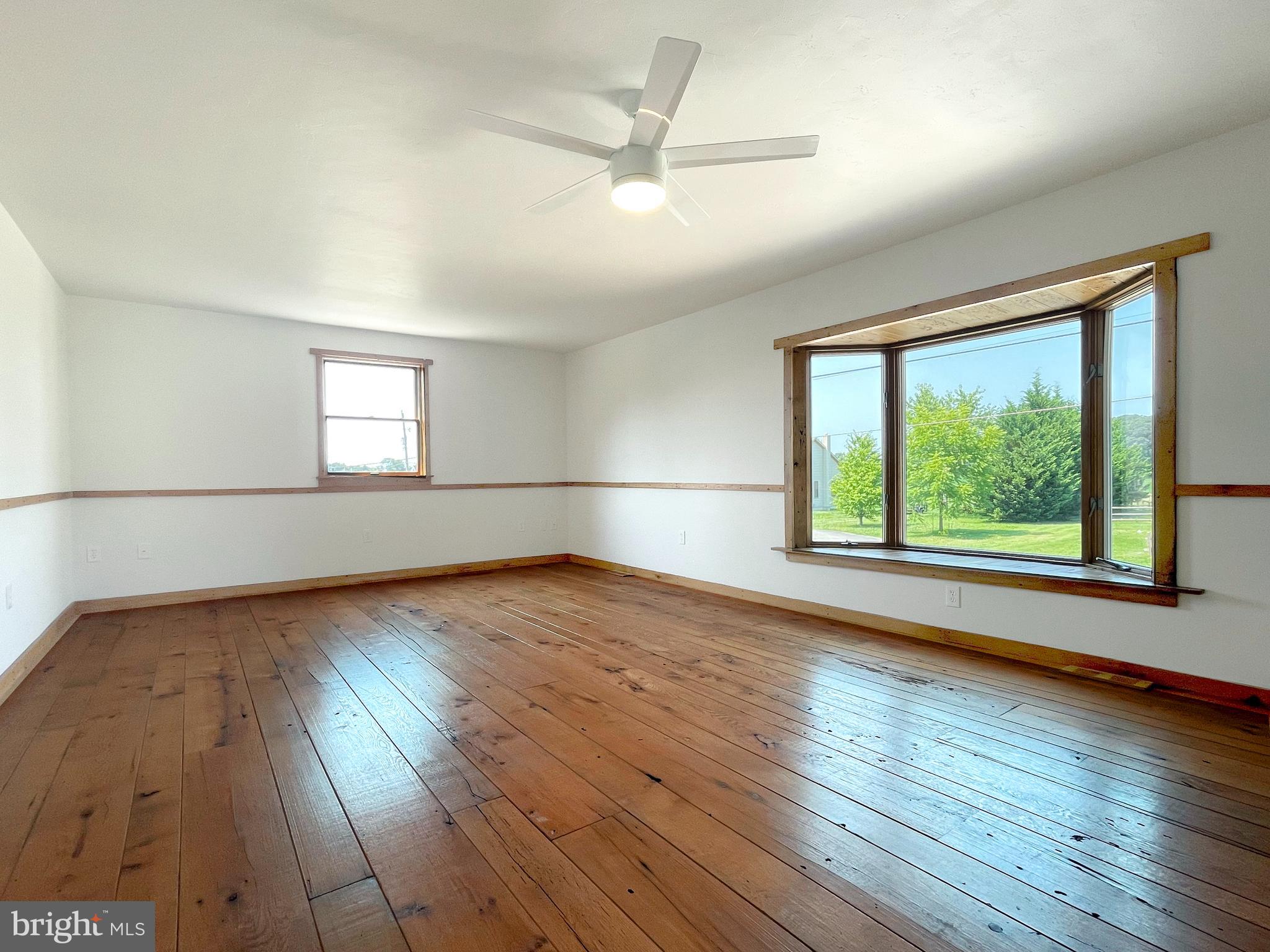 345 Pine Grove Road Hanover, PA 17331 - Photo 10 of 37 a view of empty room with wooden floor and fan