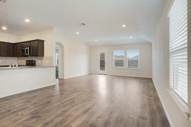 a view of kitchen with window and wooden floor