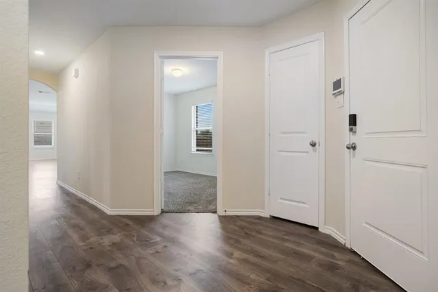 wooden floor with white walls
