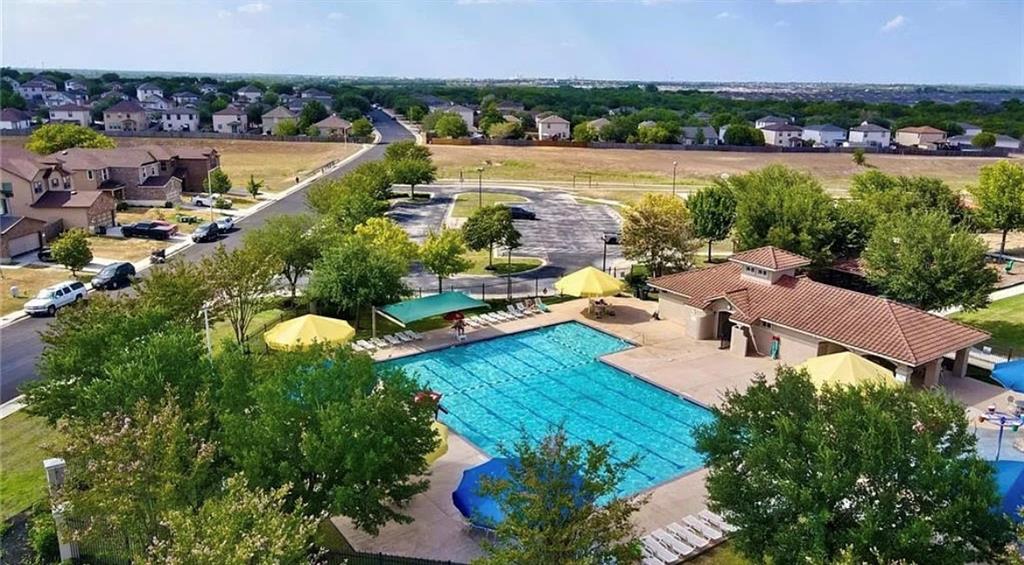 521 New Country Road Kyle, TX 78640 - Photo 34 of 37 Aerial perspective of suburban area with a pool area