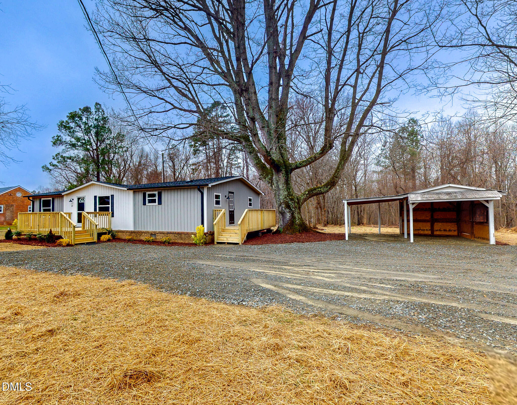 67 Halifax Road Roxboro, NC 27574 - Photo 5 of 48 a front view of a house with a yard and garage