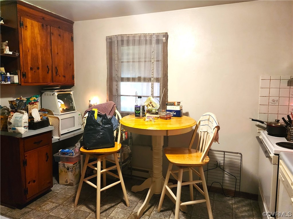 2315 Tignor Road Richmond, VA 23224 - Photo 12 of 23 a view of a dining room with furniture and window