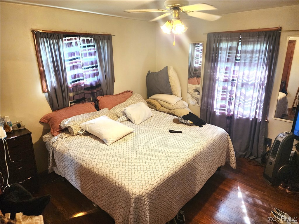 2315 Tignor Road Richmond, VA 23224 - Photo 16 of 23 a bedroom with a bed and a chandelier