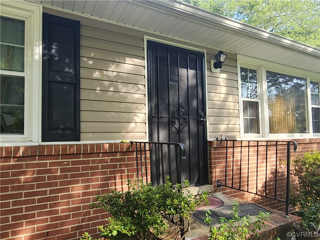 2315 Tignor Road Richmond, VA 23224 - Photo 3 of 23 a view of a brick house with a large window