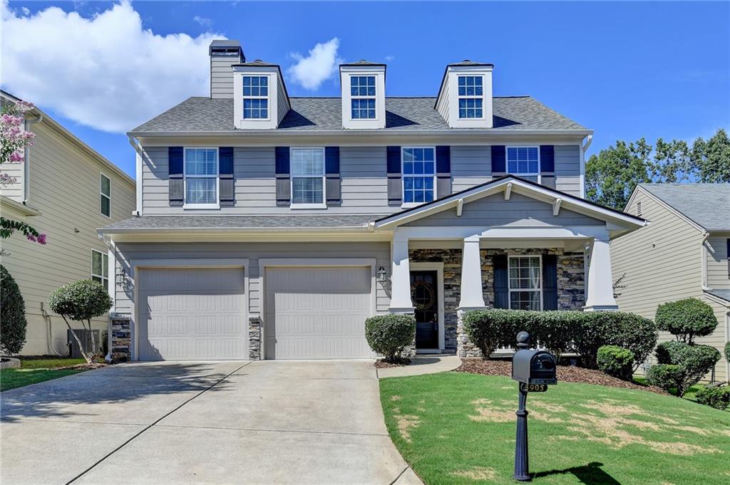 3905 Silver Springs Road Cumming, GA 30041 - Photo 1 of 1 a front view of residential houses with yard and green space