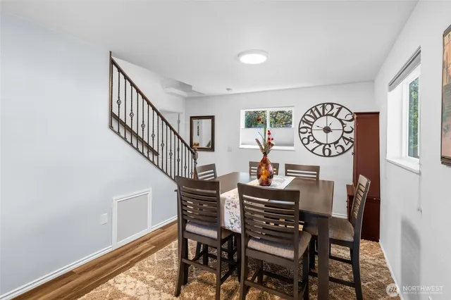 a view of a dining room with furniture window and wooden floor