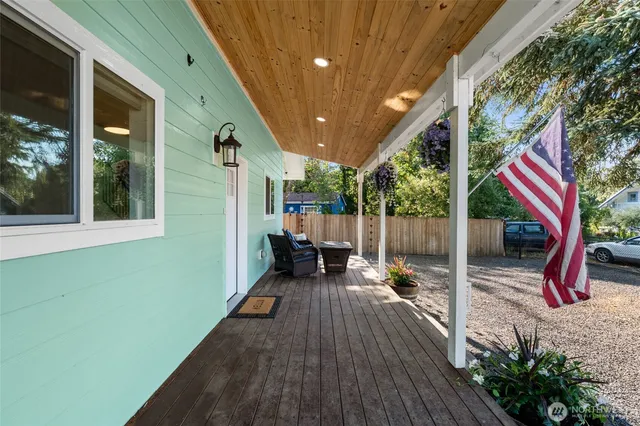 a view of a house with porch and furniture