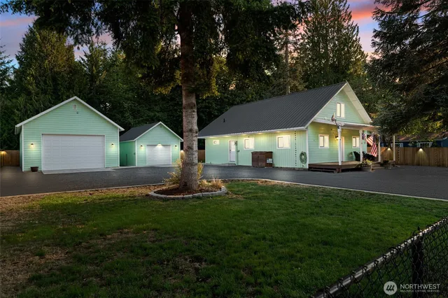 a front view of house with yard and green space