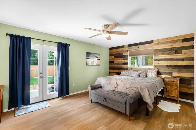 a bedroom with a large bed and a window