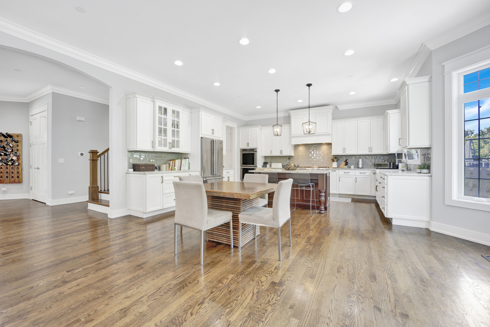 355 St Charles Road Glen Ellyn, IL 60137 - Photo 12 of 44 a living room with stainless steel appliances kitchen island granite countertop wooden floor and a view of kitchen
