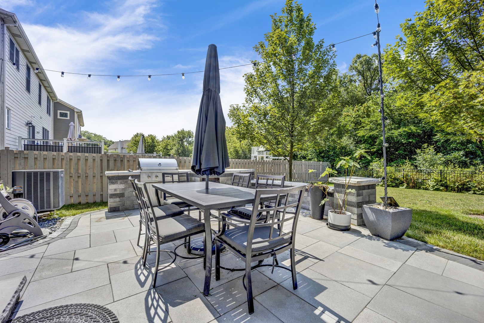 355 St Charles Road Glen Ellyn, IL 60137 - Photo 18 of 44 a view of a patio with a table and chairs
