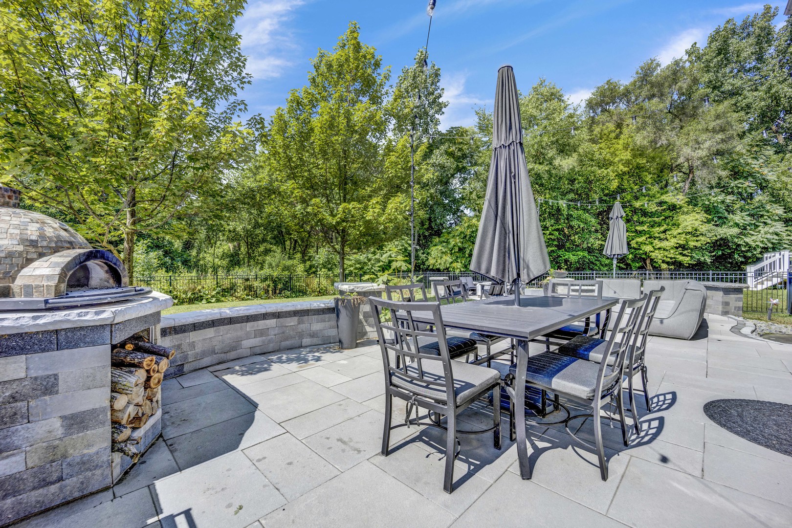 355 St Charles Road Glen Ellyn, IL 60137 - Photo 19 of 44 a view of a patio with table and chairs and potted plants
