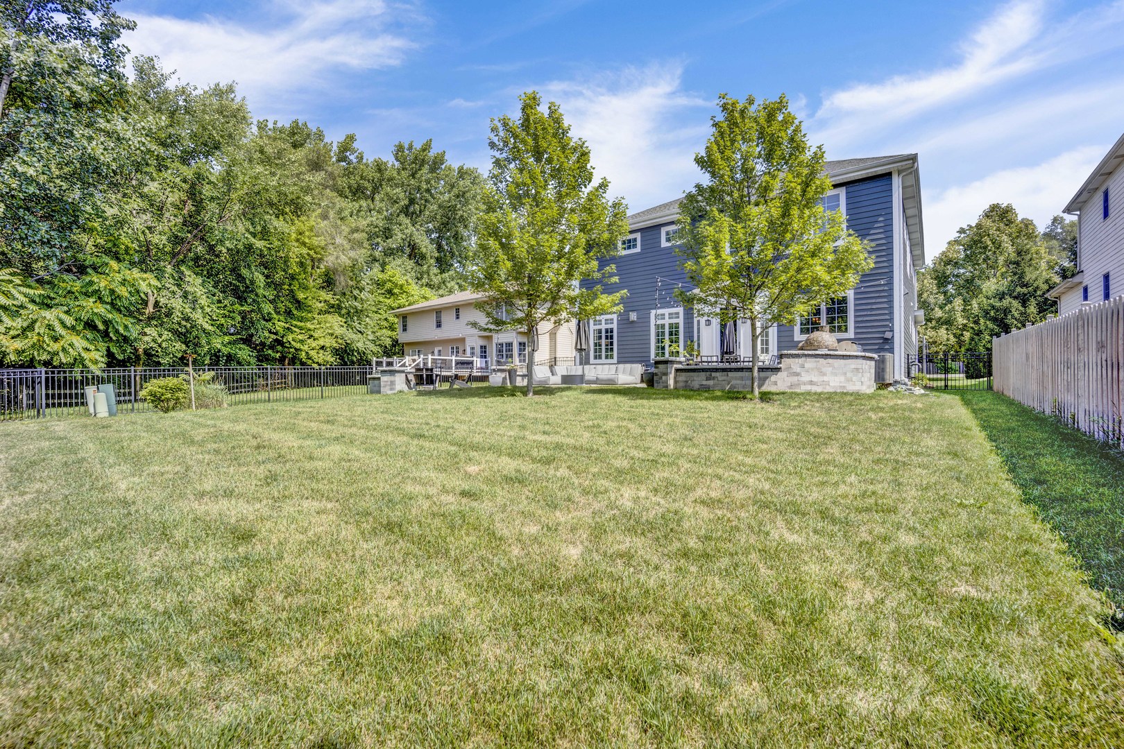 355 St Charles Road Glen Ellyn, IL 60137 - Photo 21 of 44 a view of a house with a big yard and potted plants