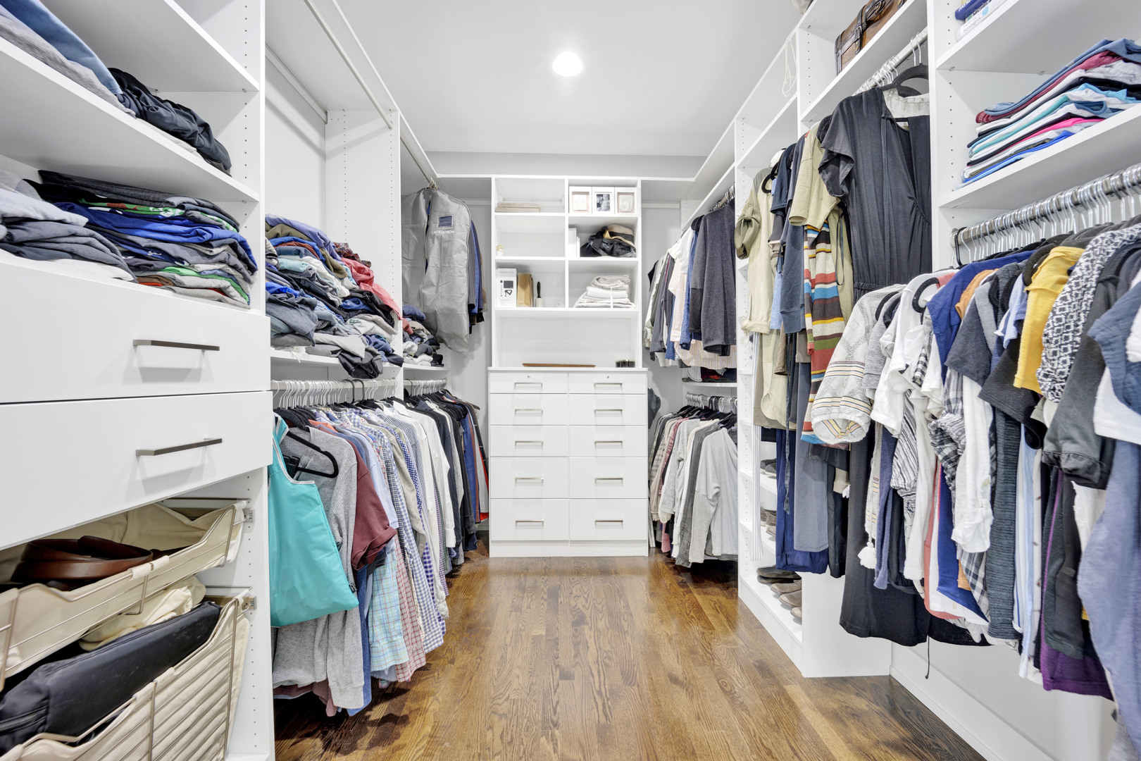 355 St Charles Road Glen Ellyn, IL 60137 - Photo 27 of 44 a view of walk in closet with clothes and shoes