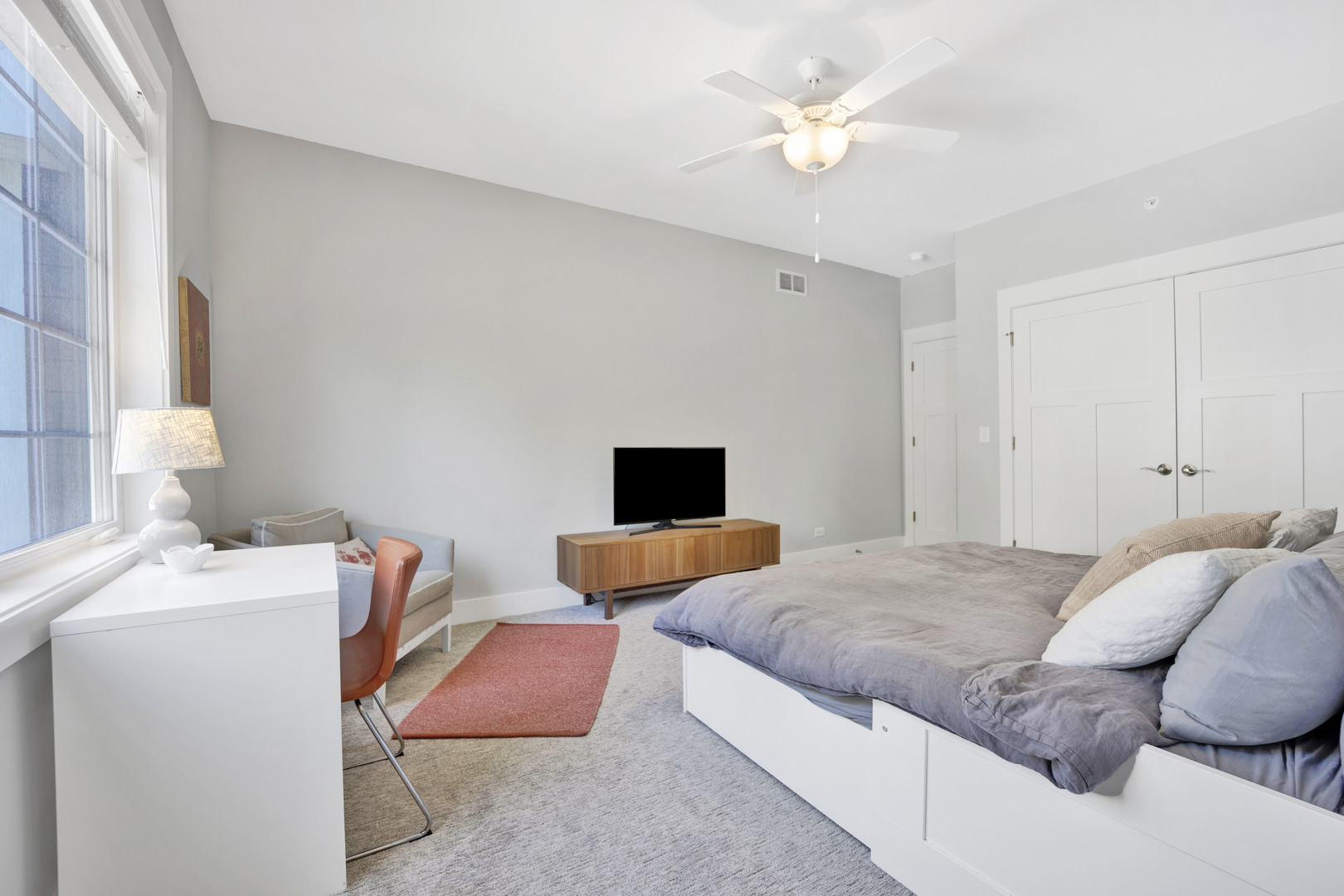 355 St Charles Road Glen Ellyn, IL 60137 - Photo 32 of 44 a bedroom with a bed and a chandelier