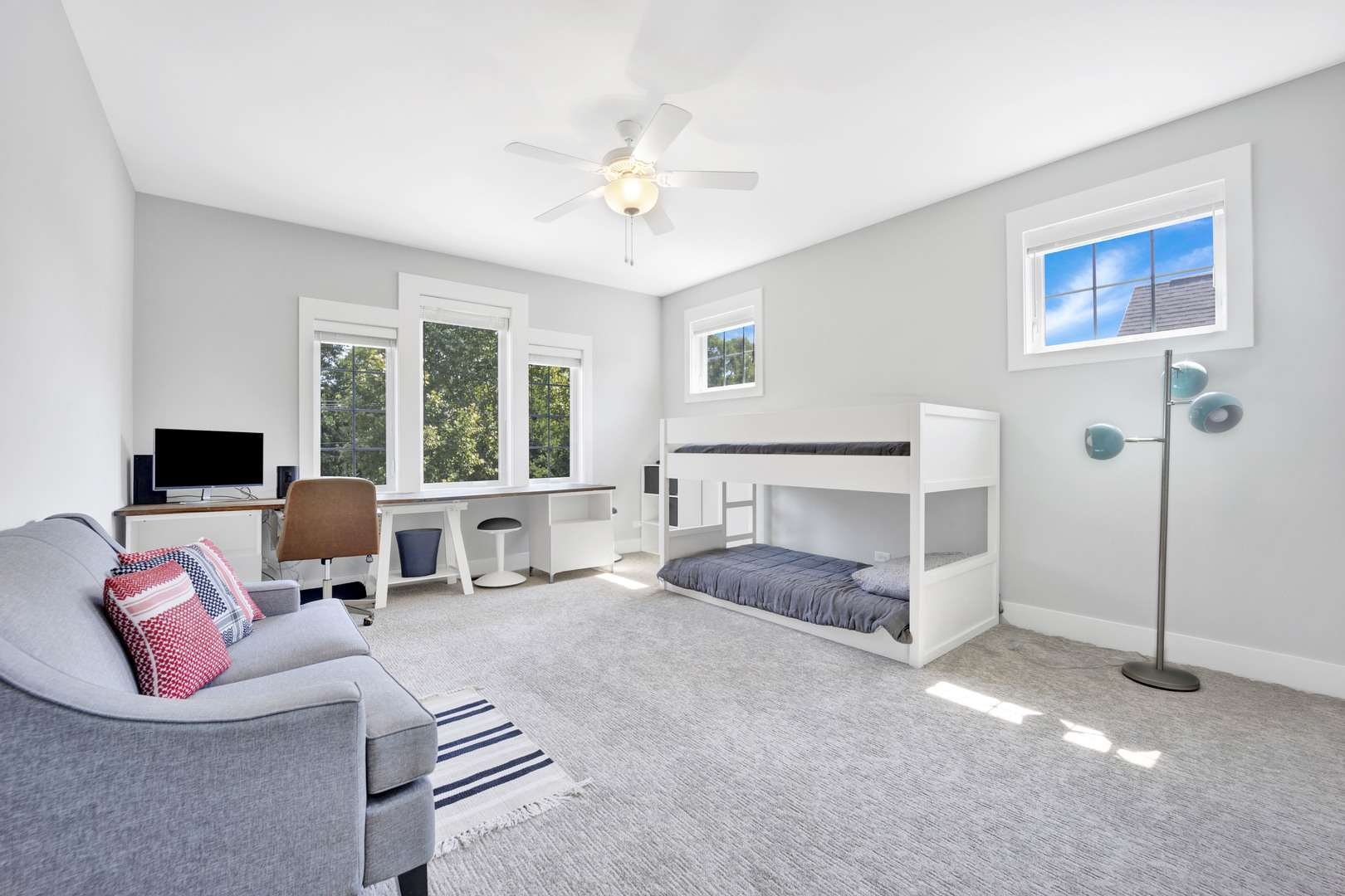355 St Charles Road Glen Ellyn, IL 60137 - Photo 35 of 44 a living room with furniture large window and a flat screen tv