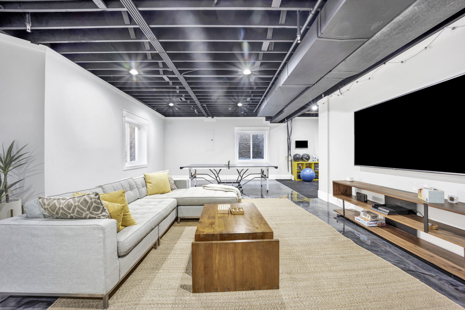 355 St Charles Road Glen Ellyn, IL 60137 - Photo 42 of 44 a living room with furniture and a flat screen tv