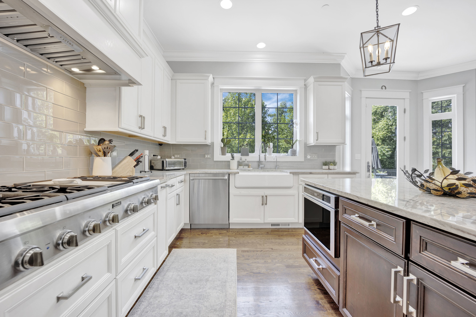355 St Charles Road Glen Ellyn, IL 60137 - Photo 8 of 44 a kitchen with a sink stove and cabinets