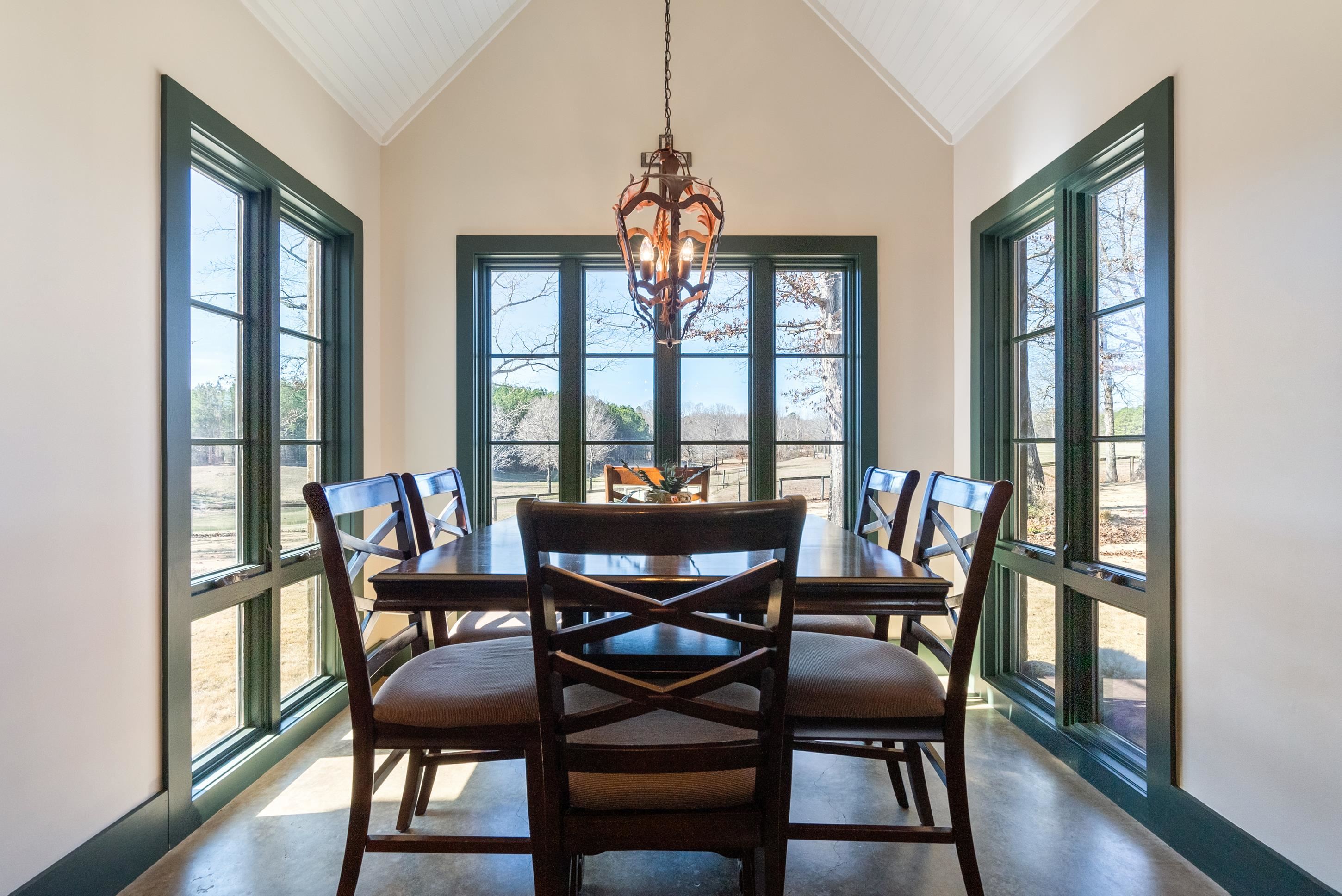 891 Musgray Road Holly Springs, MS 38635 - Photo 11 of 38 a view of a dining room with furniture window and wooden floor