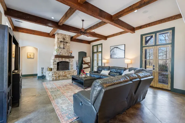 a living room with fireplace furniture and a fireplace