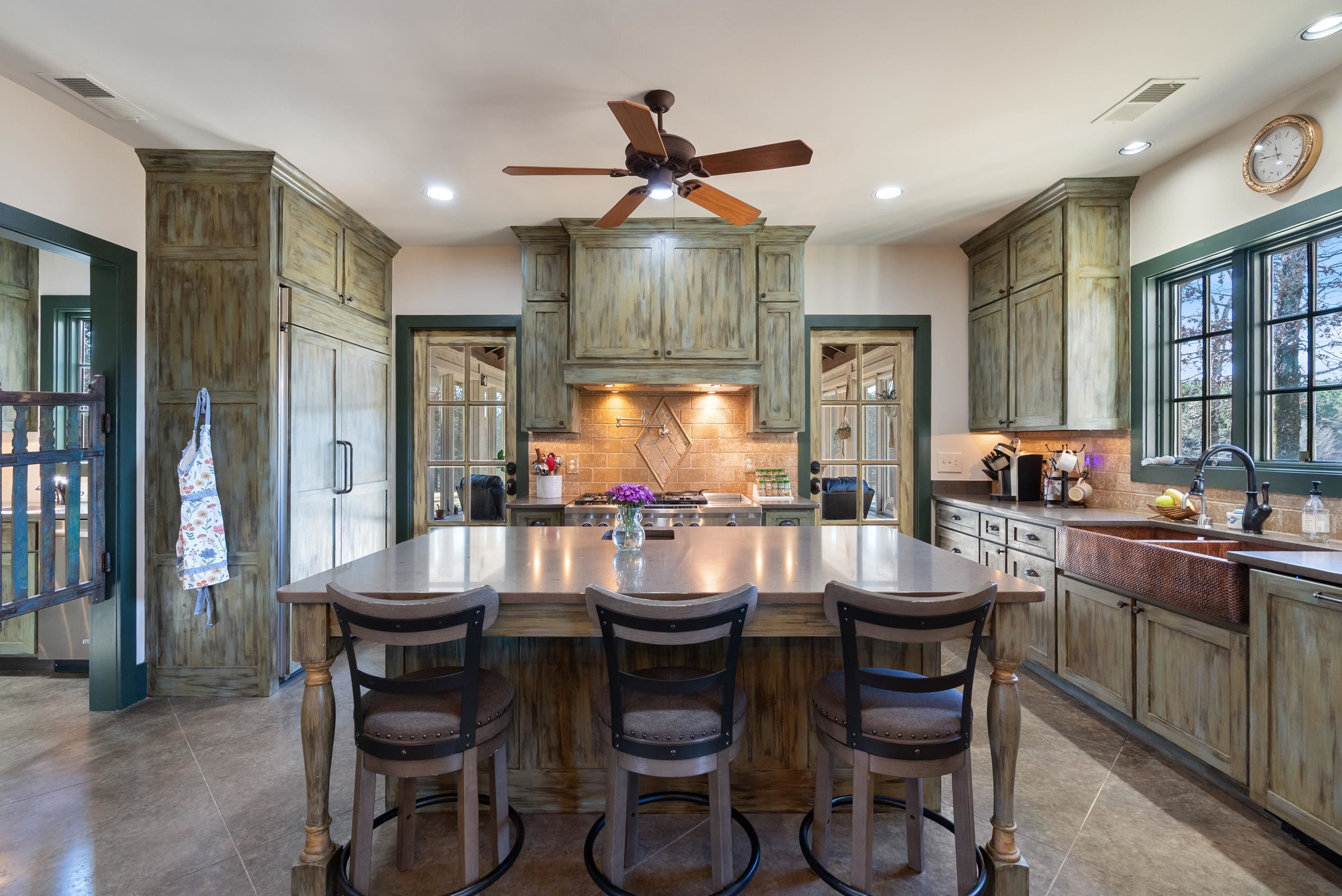 891 Musgray Road Holly Springs, MS 38635 - Photo 15 of 38 a kitchen with a dining table and chairs