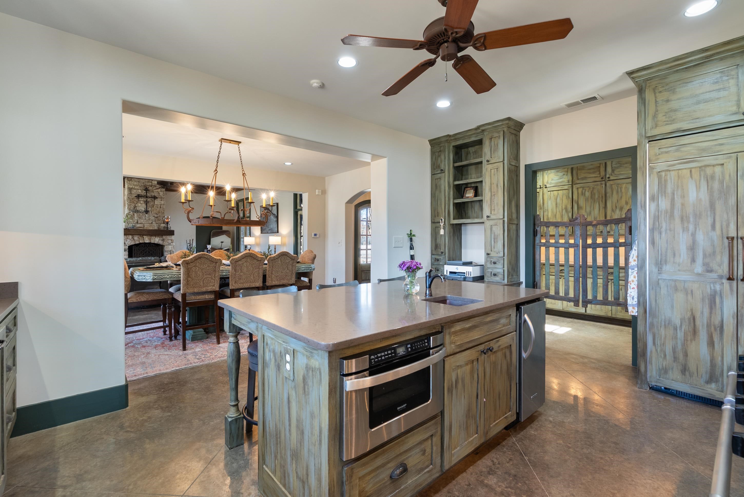 891 Musgray Road Holly Springs, MS 38635 - Photo 17 of 38 a kitchen with a stove and a refrigerator