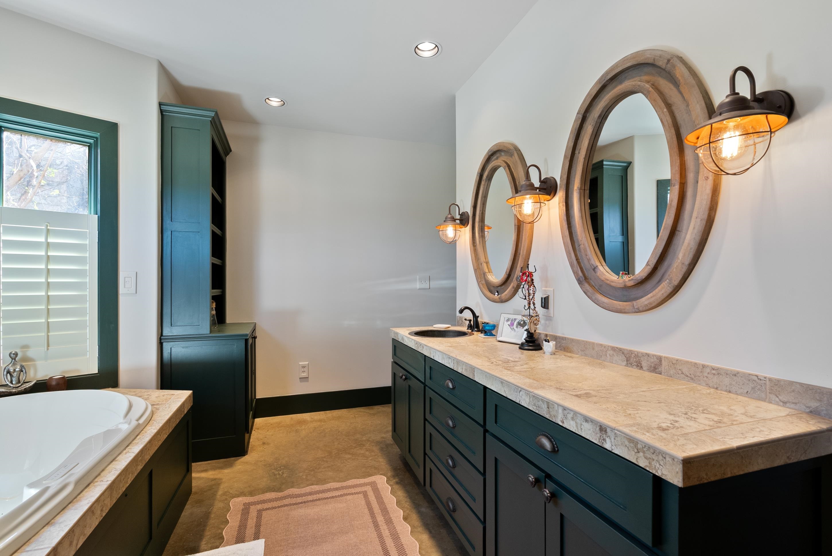 891 Musgray Road Holly Springs, MS 38635 - Photo 27 of 38 a bathroom with a sink and a mirror